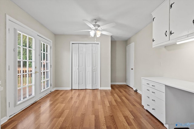 905 Cedar St SW, Decatur, AL 35601 - unfurnished bedroom with light wood-style floors, baseboards, a closet, and ceiling fan