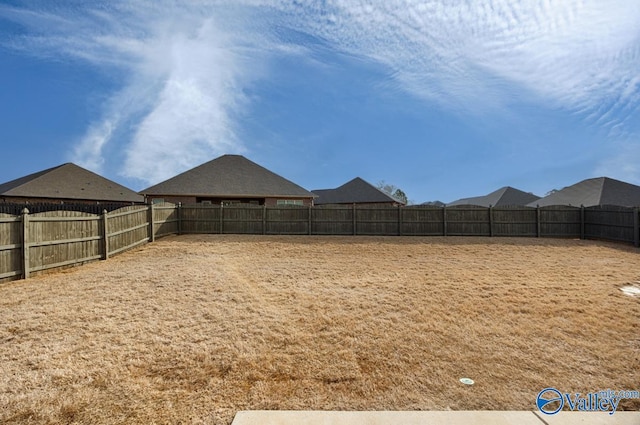 view of yard featuring a fenced backyard