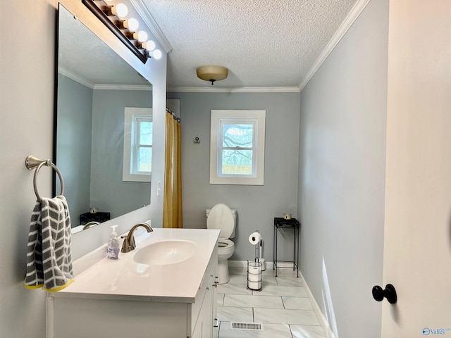 bathroom featuring visible vents, crown molding, vanity, and a textured ceiling