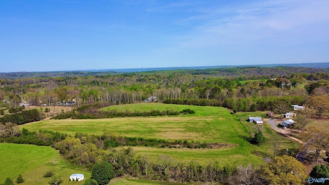 aerial view featuring a forest view and a rural view