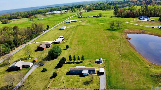 birds eye view of property featuring a water view and a rural view