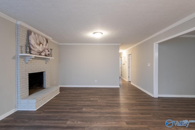 unfurnished living room with dark hardwood / wood-style floors, crown molding, a textured ceiling, and a brick fireplace