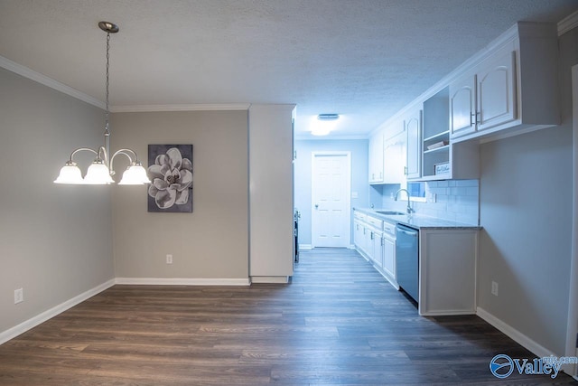 kitchen featuring dishwasher, backsplash, crown molding, white cabinetry, and a chandelier