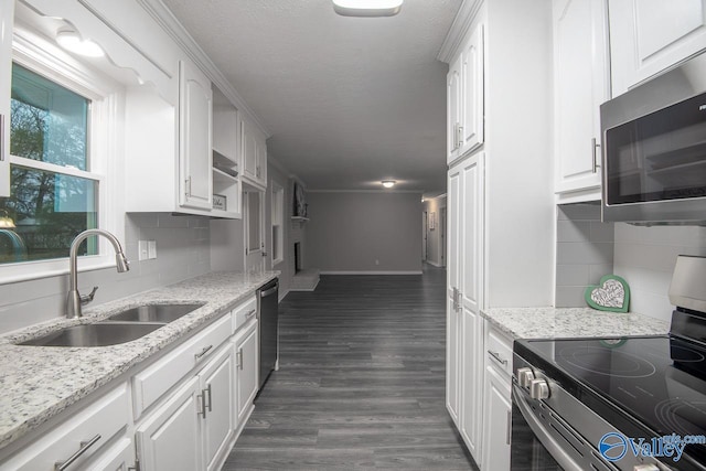 kitchen with white cabinets, sink, and appliances with stainless steel finishes