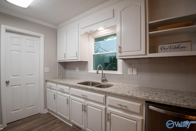 kitchen with dishwasher, white cabinets, light stone counters, and sink