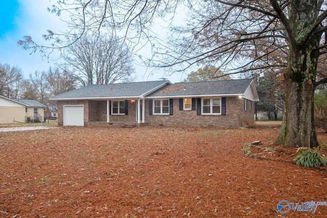 single story home with a garage