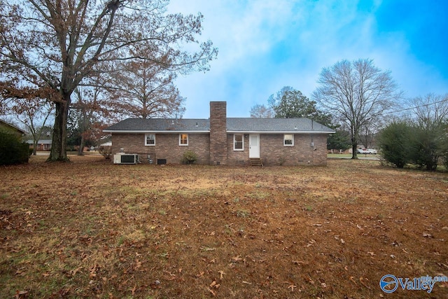 back of house featuring central air condition unit