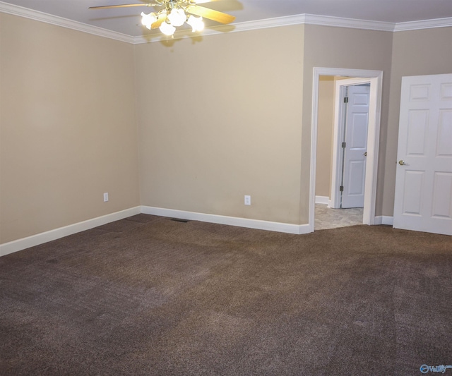 carpeted spare room featuring ceiling fan and ornamental molding