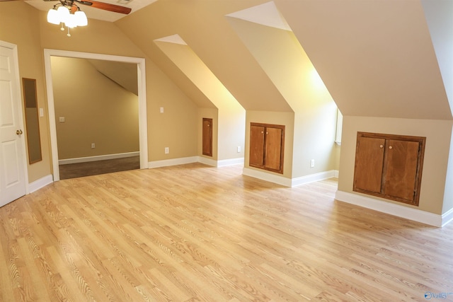 bonus room with ceiling fan, light wood-type flooring, and vaulted ceiling