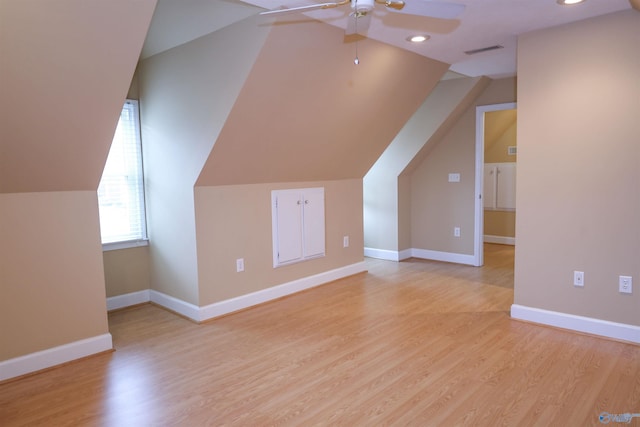 additional living space with ceiling fan, light hardwood / wood-style flooring, and lofted ceiling