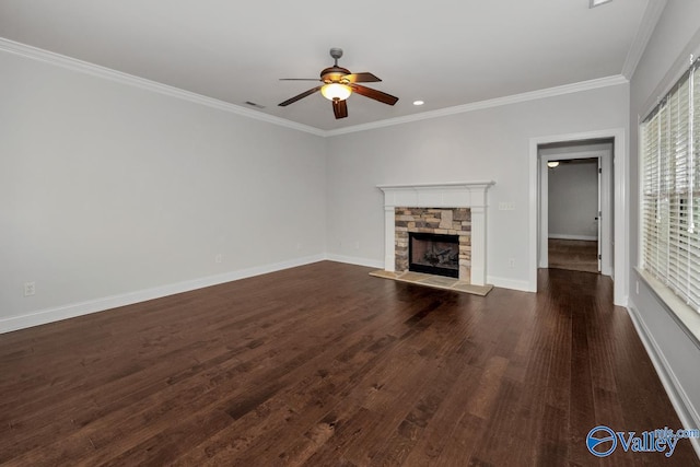 unfurnished living room with ceiling fan, a fireplace, dark hardwood / wood-style floors, and crown molding