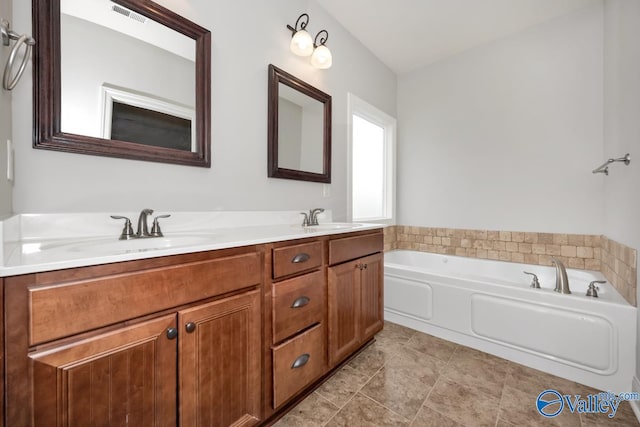 bathroom featuring vanity and a tub