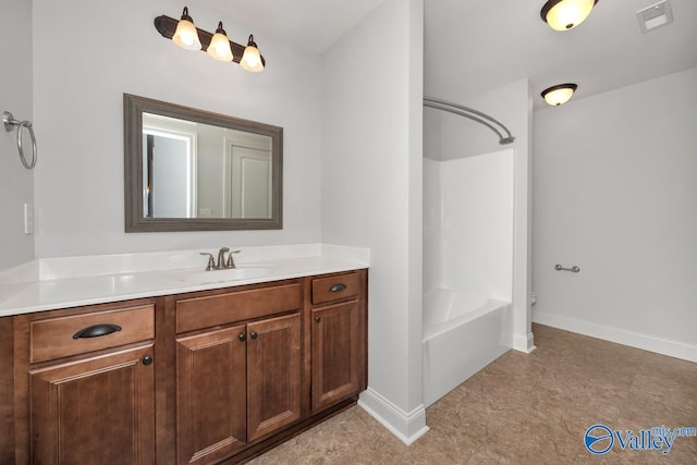 bathroom featuring washtub / shower combination and vanity