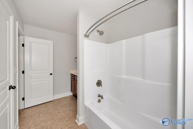 bathroom with vanity and shower / bathing tub combination