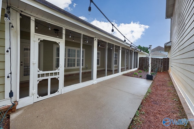 view of patio with a sunroom