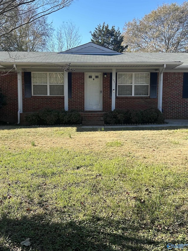 ranch-style house with a front lawn