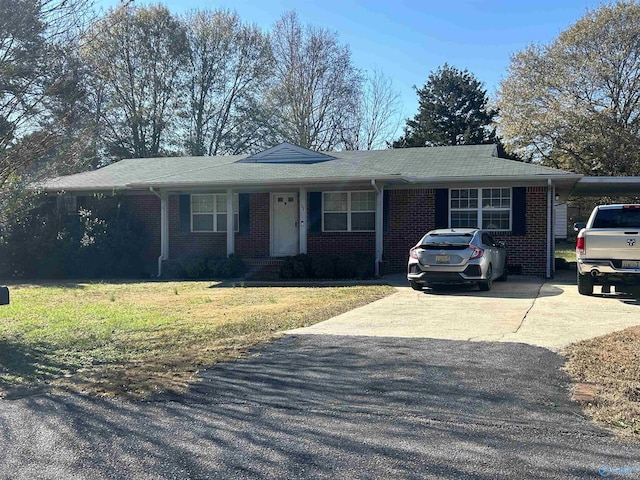 ranch-style home with a front lawn and a carport