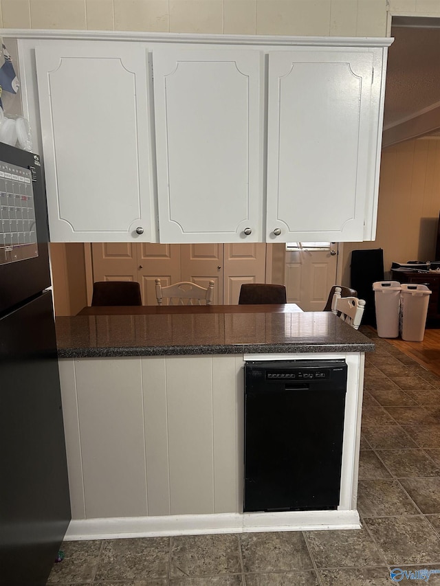 kitchen featuring black appliances, white cabinetry, and kitchen peninsula