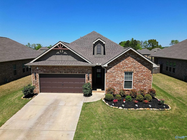 craftsman inspired home with brick siding, a shingled roof, a front lawn, and driveway