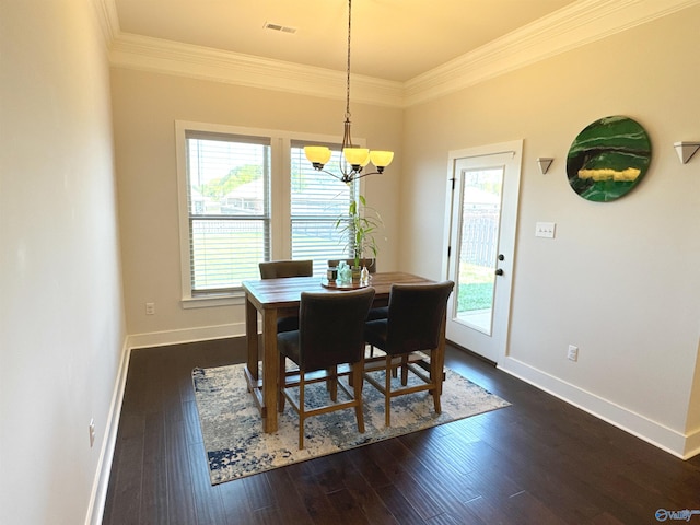 dining space with baseboards, a notable chandelier, ornamental molding, and a wealth of natural light