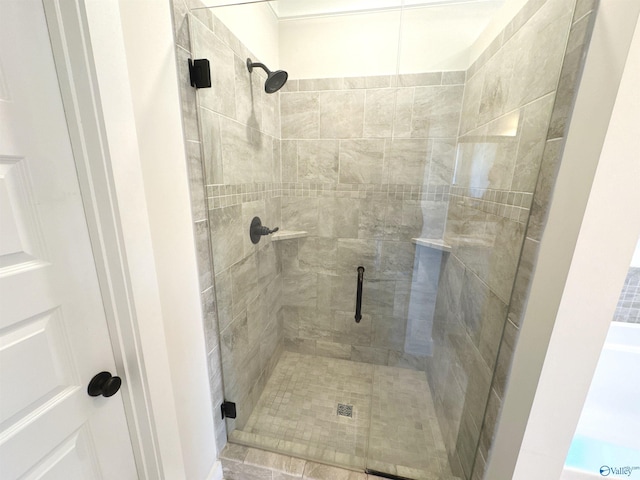 bathroom with a shower stall