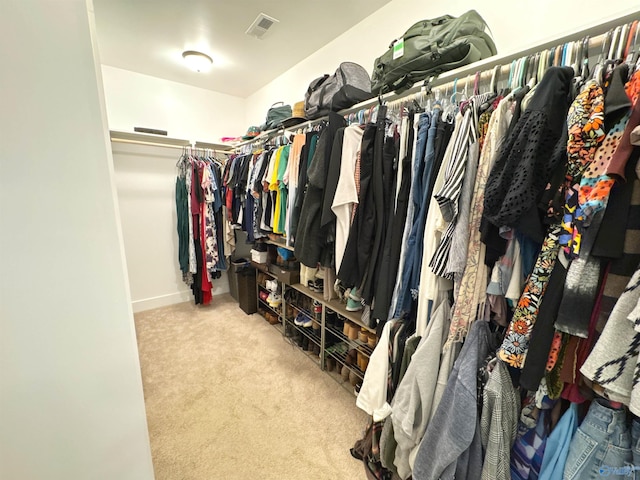spacious closet with visible vents and carpet