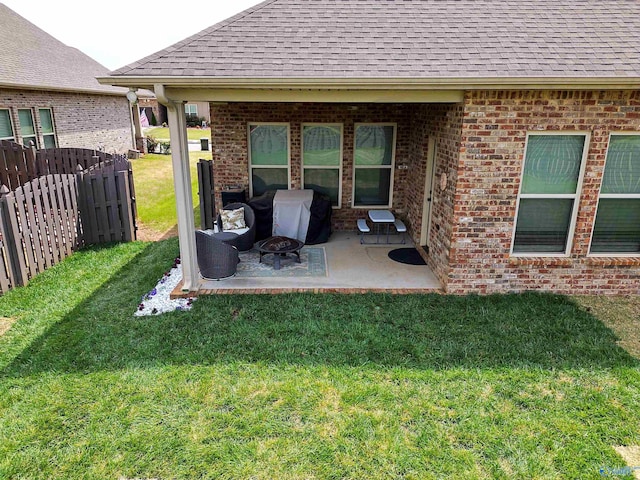 view of yard featuring fence and a patio