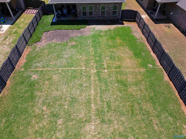 view of yard with a fenced backyard