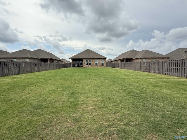 view of yard with a fenced backyard