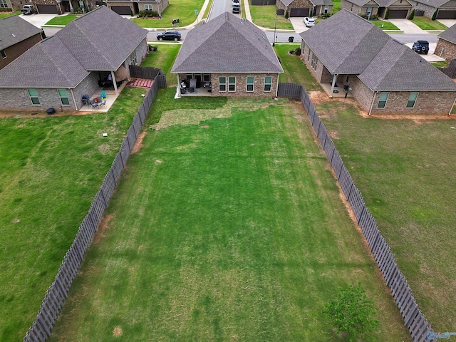birds eye view of property with a residential view