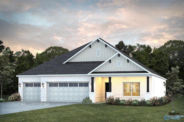 view of front facade with a garage and a lawn