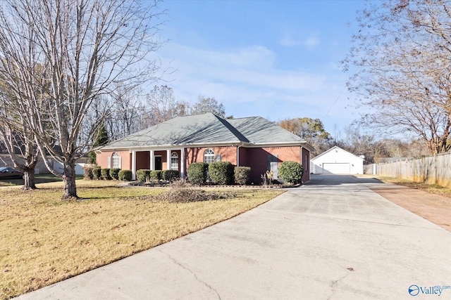 ranch-style house featuring a front yard and a garage