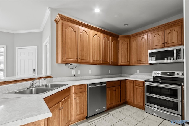 kitchen with light tile patterned flooring, stainless steel appliances, crown molding, and sink