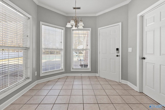 unfurnished dining area with light tile patterned floors, crown molding, and a chandelier