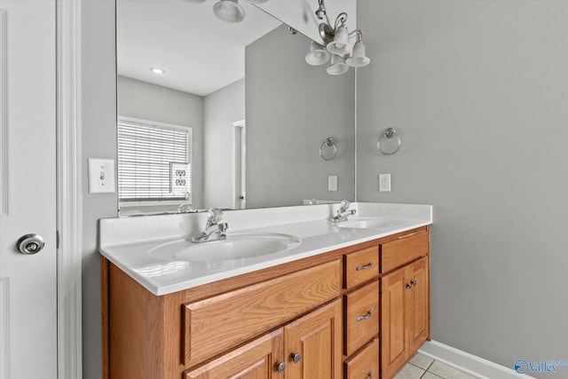 bathroom with tile patterned flooring and vanity