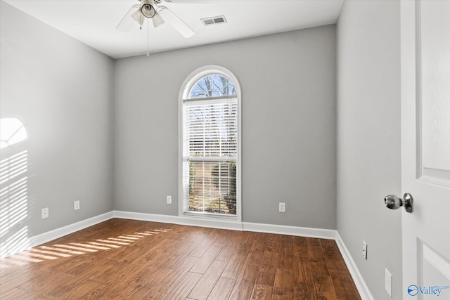 unfurnished room with ceiling fan and hardwood / wood-style flooring