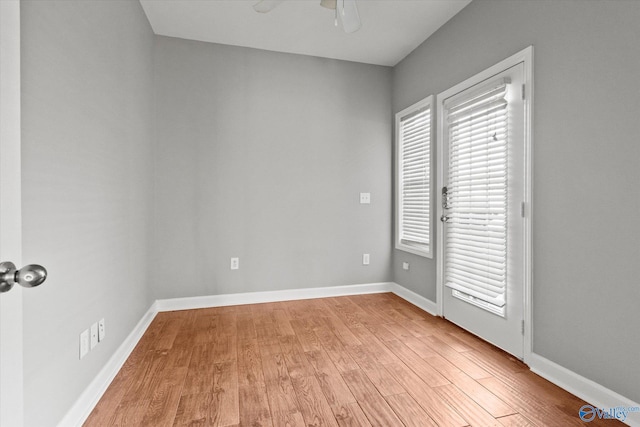 unfurnished room with light hardwood / wood-style flooring and ceiling fan