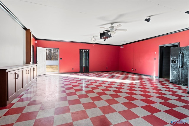 unfurnished living room with ceiling fan and ornamental molding