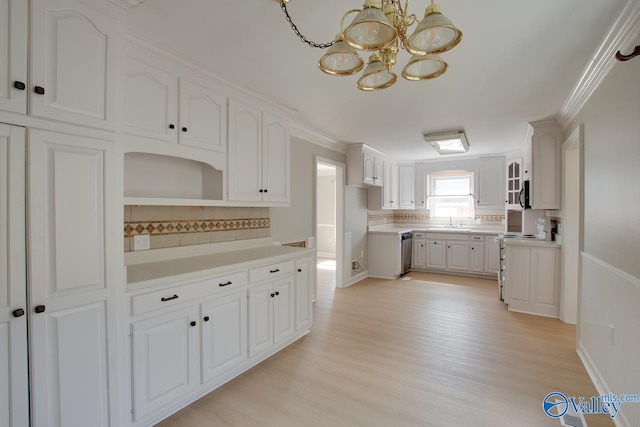 kitchen featuring light hardwood / wood-style floors, white cabinetry, decorative backsplash, and range with electric cooktop