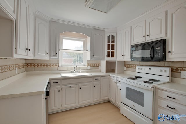 kitchen featuring sink, tasteful backsplash, white cabinets, white electric range, and light wood-type flooring