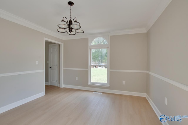 119 Victoria Dr, Madison, AL 35758 - unfurnished room with a chandelier, light wood finished floors, baseboards, and ornamental molding