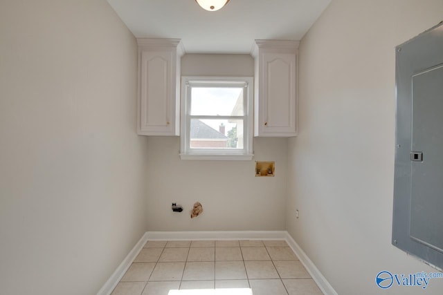 washroom with gas dryer hookup, hookup for a washing machine, and light tile patterned floors