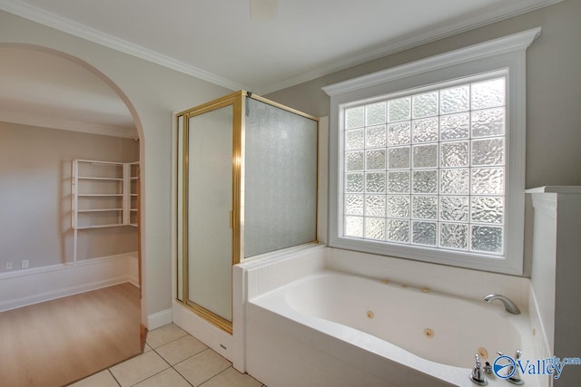 bathroom with tile patterned floors, separate shower and tub, and crown molding