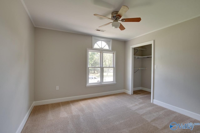 119 Victoria Dr, Madison, AL 35758 - unfurnished bedroom with ornamental molding, light carpet, baseboards, ceiling fan, and a closet