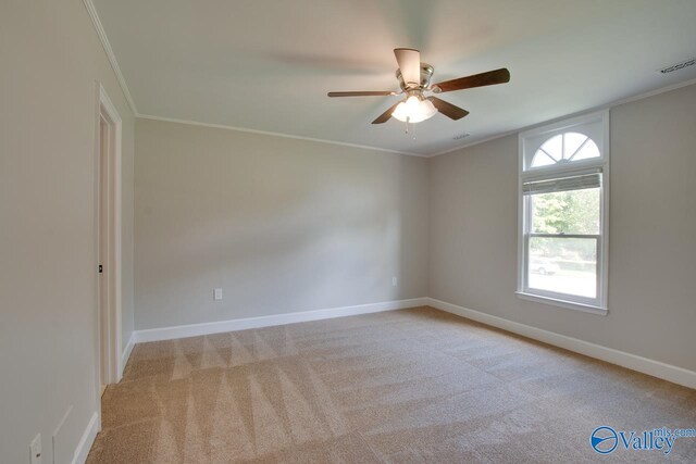 119 Victoria Dr, Madison, AL 35758 - unfurnished room featuring light carpet, crown molding, a ceiling fan, and baseboards