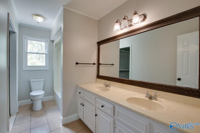 119 Victoria Dr, Madison, AL 35758 - full bath with double vanity, crown molding, tile patterned floors, toilet, and a tub to relax in