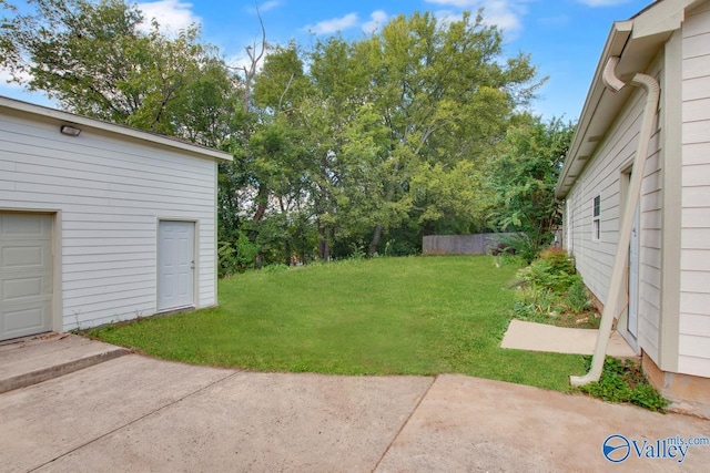 119 Victoria Dr, Madison, AL 35758 - view of grassy yard featuring a patio and a garage
