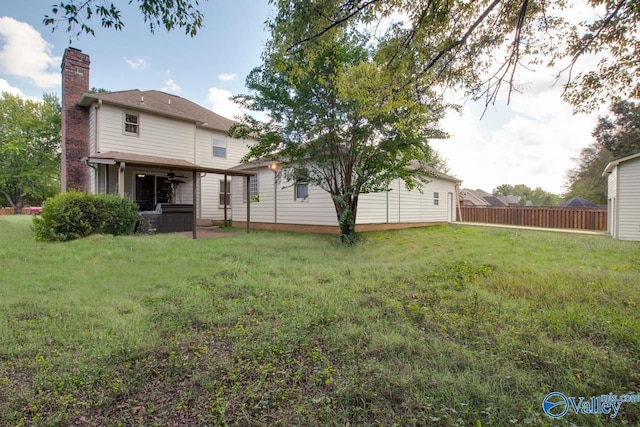 119 Victoria Dr, Madison, AL 35758 - rear view of house featuring a chimney and a ceiling fan