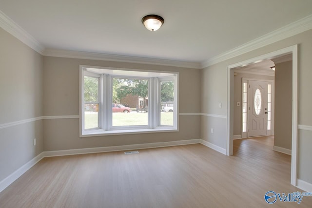 119 Victoria Dr, Madison, AL 35758 - spare room featuring light wood finished floors, baseboards, and ornamental molding