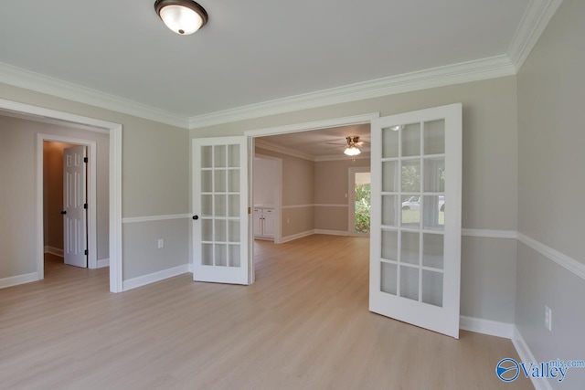 empty room featuring light wood-type flooring, french doors, ceiling fan, and crown molding